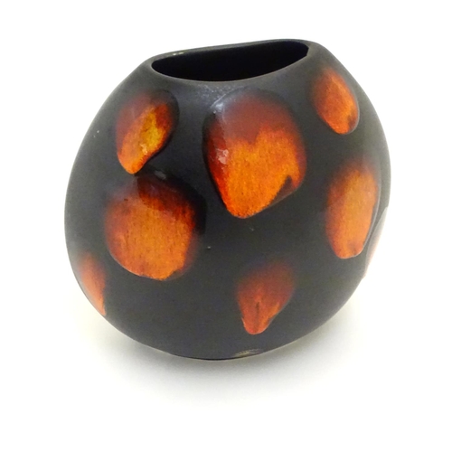 129 - A Poole Pottery purse vase in the living glaze galaxy pattern. Marked under. Approx. 7