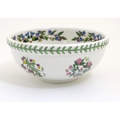 133 - Five items of Portmeirion wares comprising a large bowl, an oval serving plate, two dishes and a cer... 