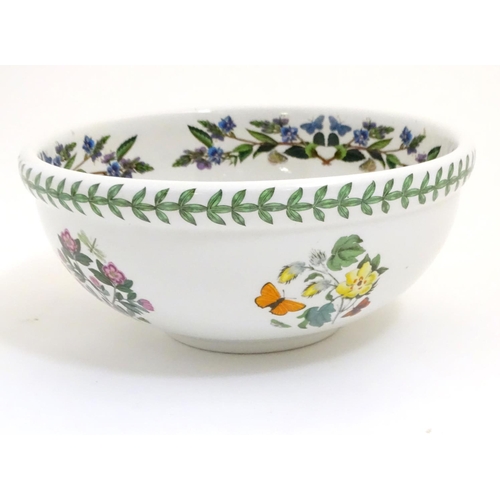 133 - Five items of Portmeirion wares comprising a large bowl, an oval serving plate, two dishes and a cer... 