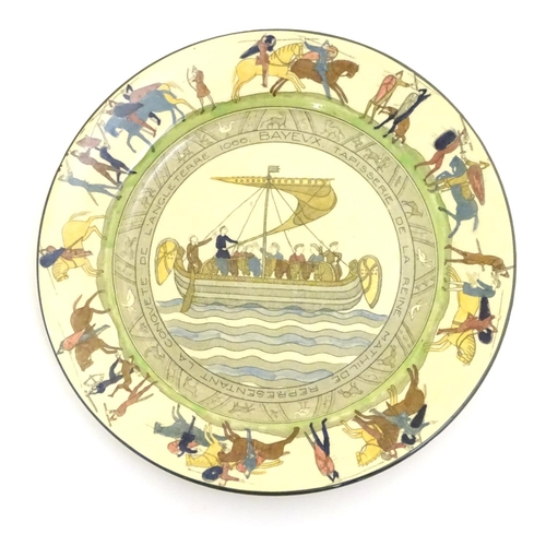 95 - A Royal Doulton plate decorated with Bayeux Tapestry scenes with figures, horses and Norman ship, et... 