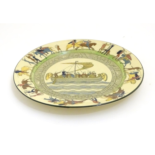 95 - A Royal Doulton plate decorated with Bayeux Tapestry scenes with figures, horses and Norman ship, et... 