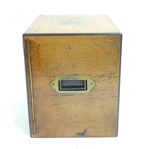 1016 - A small late 19thC oak and walnut cased military campaign chest with twin brass recessed handles, th... 