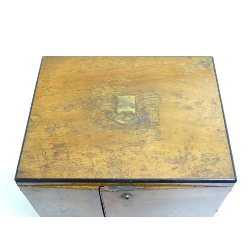 1016 - A small late 19thC oak and walnut cased military campaign chest with twin brass recessed handles, th... 