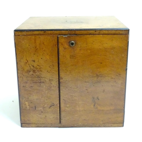 1016 - A small late 19thC oak and walnut cased military campaign chest with twin brass recessed handles, th... 