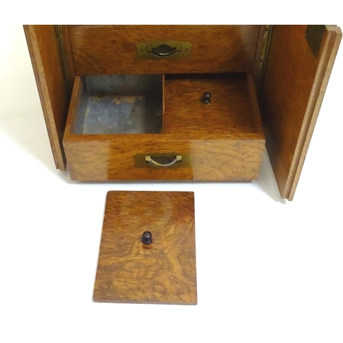 1016 - A small late 19thC oak and walnut cased military campaign chest with twin brass recessed handles, th... 