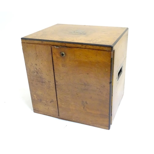 1016 - A small late 19thC oak and walnut cased military campaign chest with twin brass recessed handles, th... 