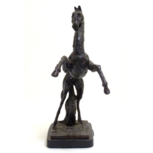 1022 - A 20thC bronze sculpture of a rearing horse on a rectangular base. Approx. 18