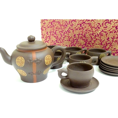 1026 - Chinese yixing clay style teapot, cups and saucers with roundel detail. Impressed character marks un... 