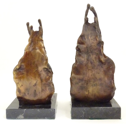 1029 - A pair of 20thC cast bronze bookends modelled as snails, each on a rectangular marble base. Approx. ... 