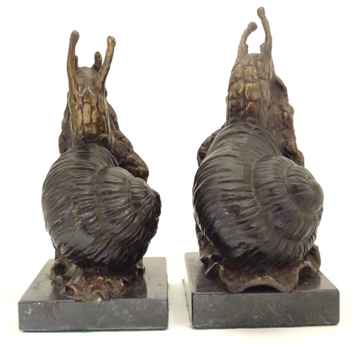 1029 - A pair of 20thC cast bronze bookends modelled as snails, each on a rectangular marble base. Approx. ... 