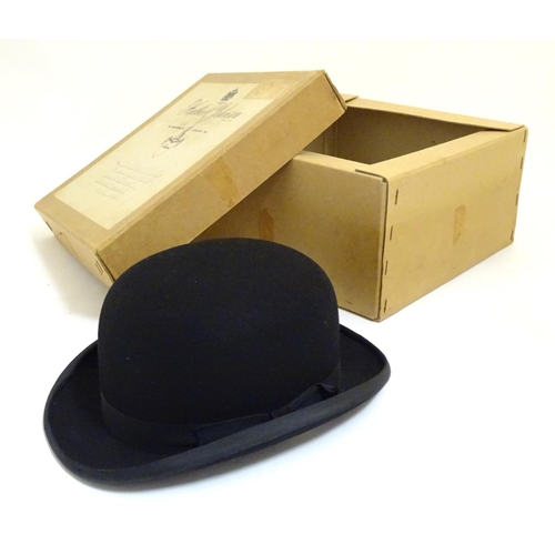 1030 - An early 20thC handmade fur felt bowler hat contained within original Herbert Johnson hatters box.