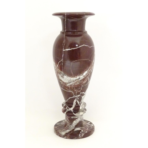 1048 - A specimen marble vase of baluster form with a flared rim. Approx. 11 3/4