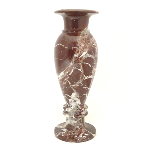 1048 - A specimen marble vase of baluster form with a flared rim. Approx. 11 3/4