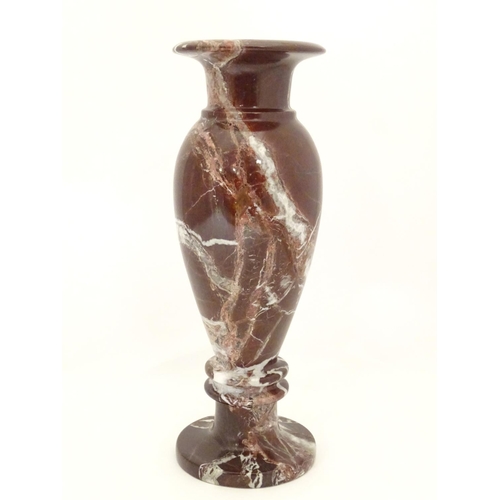 1048 - A specimen marble vase of baluster form with a flared rim. Approx. 11 3/4