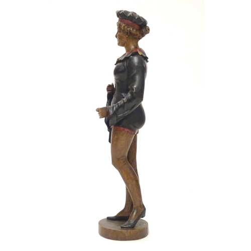 1049 - A 20thC carved wooden sculpture modelled as a woman wearing a jester style outfit with polychrome de... 