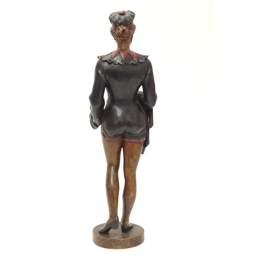 1049 - A 20thC carved wooden sculpture modelled as a woman wearing a jester style outfit with polychrome de... 