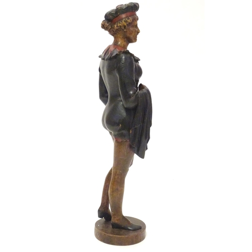 1049 - A 20thC carved wooden sculpture modelled as a woman wearing a jester style outfit with polychrome de... 