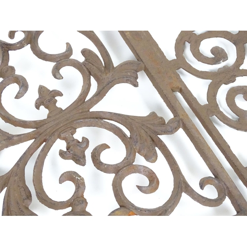 1057 - Two wrought iron architectural panels, of waved form, 16