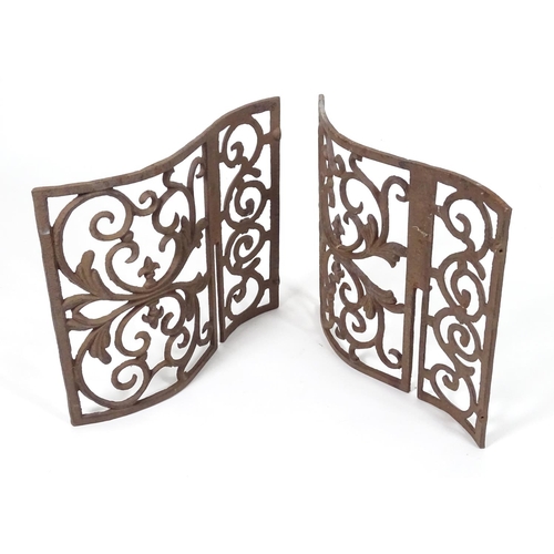 1057 - Two wrought iron architectural panels, of waved form, 16