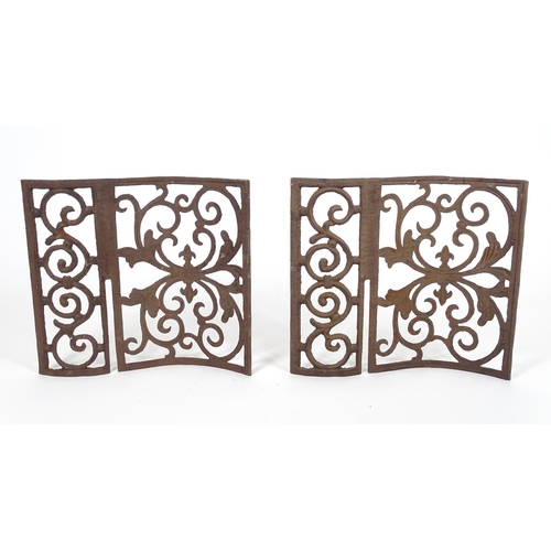 1057 - Two wrought iron architectural panels, of waved form, 16