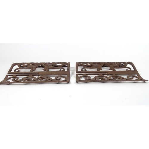 1057 - Two wrought iron architectural panels, of waved form, 16