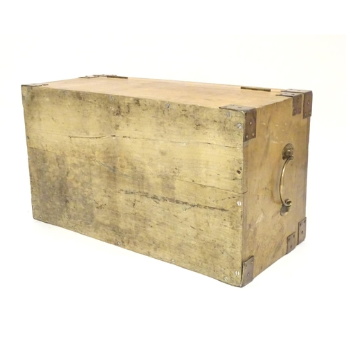 1078 - An early to mid 20thC hardwood box with brass carrying handles and brass mounts to the corners along... 