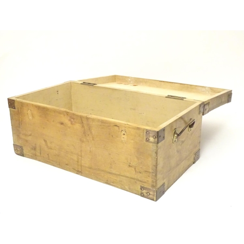 1078 - An early to mid 20thC hardwood box with brass carrying handles and brass mounts to the corners along... 