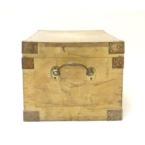 1078 - An early to mid 20thC hardwood box with brass carrying handles and brass mounts to the corners along... 