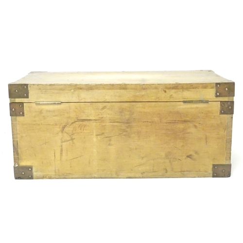 1078 - An early to mid 20thC hardwood box with brass carrying handles and brass mounts to the corners along... 