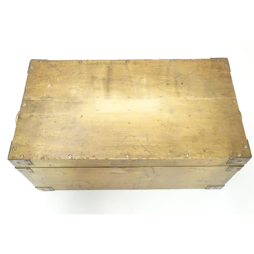 1078 - An early to mid 20thC hardwood box with brass carrying handles and brass mounts to the corners along... 