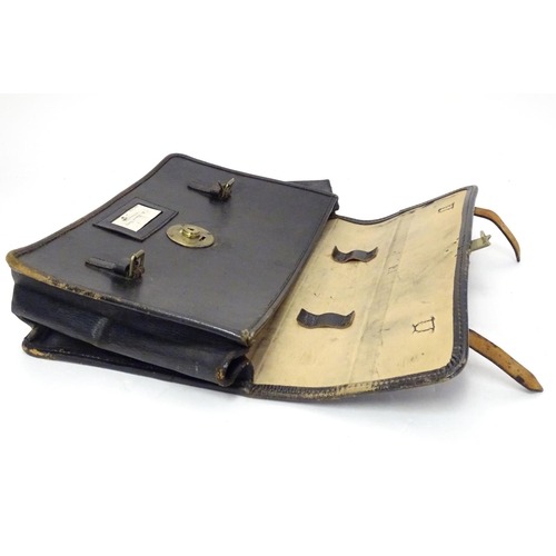 1083 - A 20thC black leather briefcase with EIIR (Elizabeth II Regina) and crown gilt insignia. Approx. 16