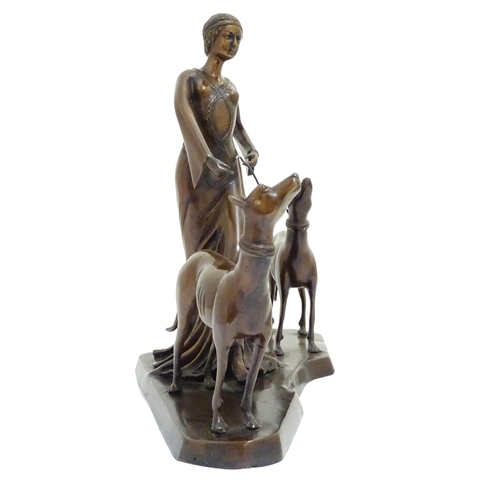 1088 - A 20thC bronze sculpture modelled as a lady walking two dogs. Approx. 17