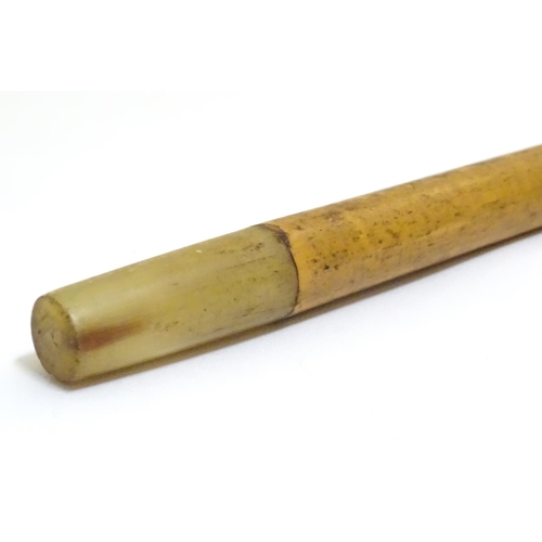 1093 - An early to mid-20thC Brigg walking stick, with 18ct gold band, amber Bakelite handle, malacca shaft... 