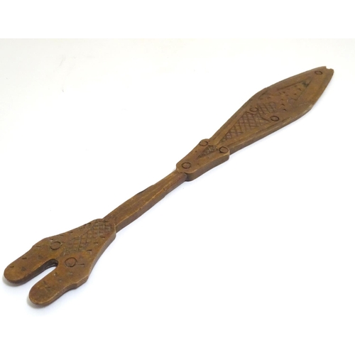 1098 - Ethnographic / Native / Tribal: A carved wooden ceremonial paddle formed as a stylised fish with car... 