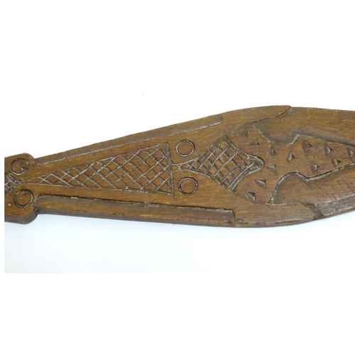 1098 - Ethnographic / Native / Tribal: A carved wooden ceremonial paddle formed as a stylised fish with car... 