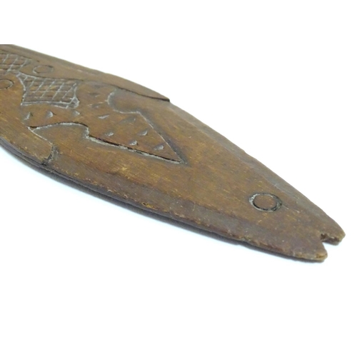 1098 - Ethnographic / Native / Tribal: A carved wooden ceremonial paddle formed as a stylised fish with car... 