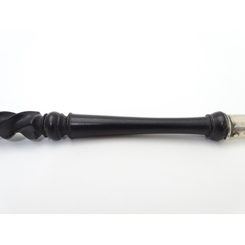 189 - A silver toasting fork with turned ebonised handle. The silver fork section hallmarked Chester 1903 ... 