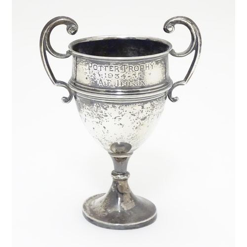 200 - A silver pedestal trophy cup with twin handles. hallmarked Sheffield 1935 maker James Edward Barry. ... 