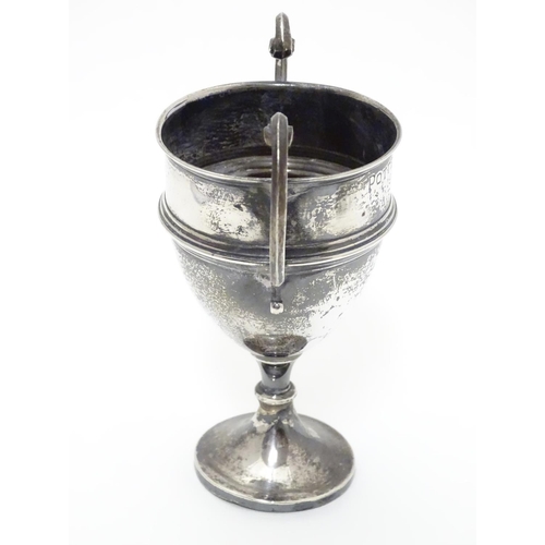 200 - A silver pedestal trophy cup with twin handles. hallmarked Sheffield 1935 maker James Edward Barry. ... 