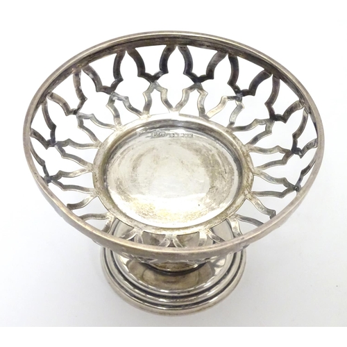 288 - A silver openwork pedestal bonbon dish on weighted base. Hallmarked Birmingham 1909 maker Elkington ... 