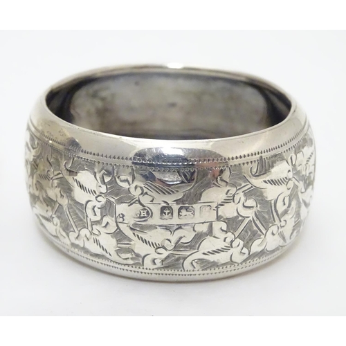 289 - Two silver napkin rings with engraved decoration. Hallmarked Birmingham 1906 maker William M Hayes a... 