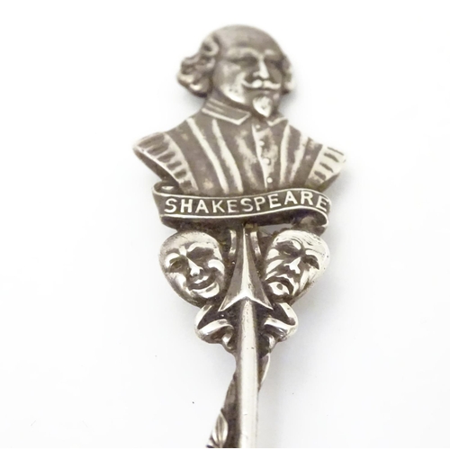 290 - A silver souvenir spoon, the leaf surrounded handle surmounted by a bust of William Shakespeare over... 