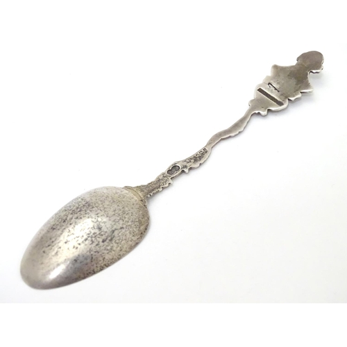 290 - A silver souvenir spoon, the leaf surrounded handle surmounted by a bust of William Shakespeare over... 