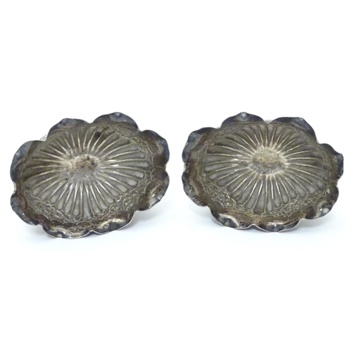 296 - A pair of Victorian silver table salts with fluted decoration and wavy rims, raised on oval pedestal... 