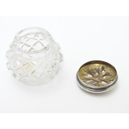 309 - A cut glass pot with silver lid with textured decoration to top. Hallmarked Birmingham 1902 maker T ... 