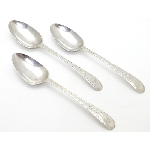 315 - Three Geo III old English pattern teaspoons with engine turned decoration. Hallmarked London 1783 ma... 