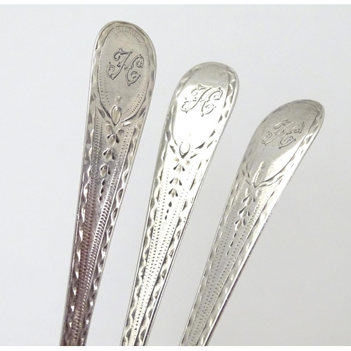 315 - Three Geo III old English pattern teaspoons with engine turned decoration. Hallmarked London 1783 ma... 