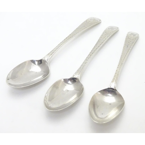 315 - Three Geo III old English pattern teaspoons with engine turned decoration. Hallmarked London 1783 ma... 