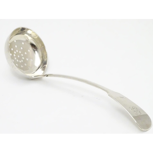 318 - A Victorian Scottish silver fiddle pattern sifting ladle. Hallmarked Edinburgh 1841 maker Mackay & C... 