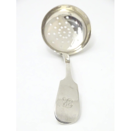 318 - A Victorian Scottish silver fiddle pattern sifting ladle. Hallmarked Edinburgh 1841 maker Mackay & C... 